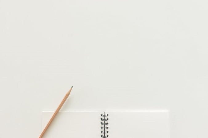 A pencil and notebook ready to learn