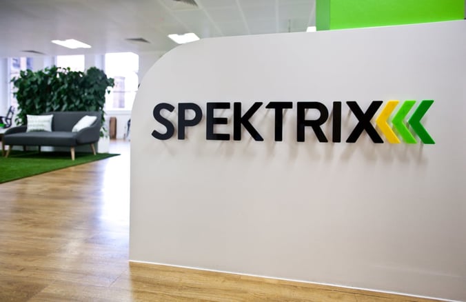 Interior of the Spektrix office, with our logo displayed on a white wall